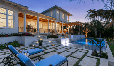Pool deck of Orchid Beach custom Florida home by Nautilus Homes
