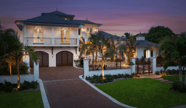 Front drive of Orchid Beach custom Florida home by Nautilus Homes