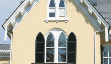 gothic windows with custom louver shutters by timberlane